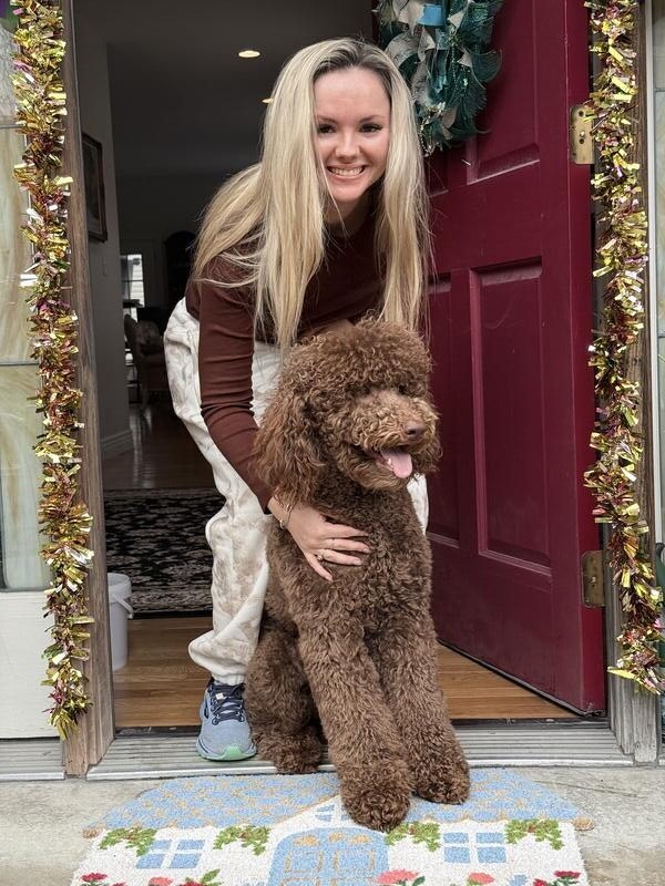 Happy customer reunited with their pet after Elite Pet Transportation delivery